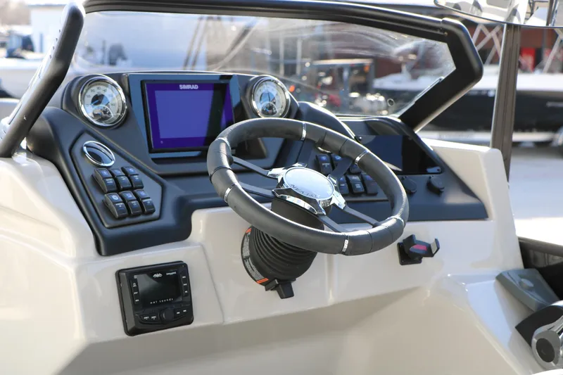Slide: The Image of 2026 Sylvan L3 DLZ boat dashboard with steering wheel and control panel. - 21