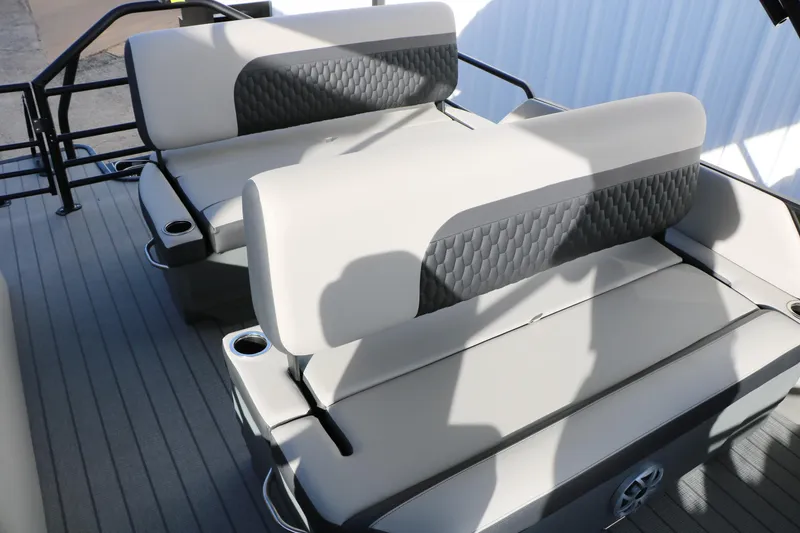 Slide: The Image of 2026 Sylvan L3 DLZ boat interior with gray seating and cup holders. - 31