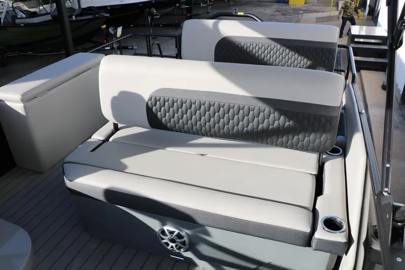 Slide: The Image of 2026 Sylvan L3 DLZ boat interior with gray cushioned seating and cup holders. - 32