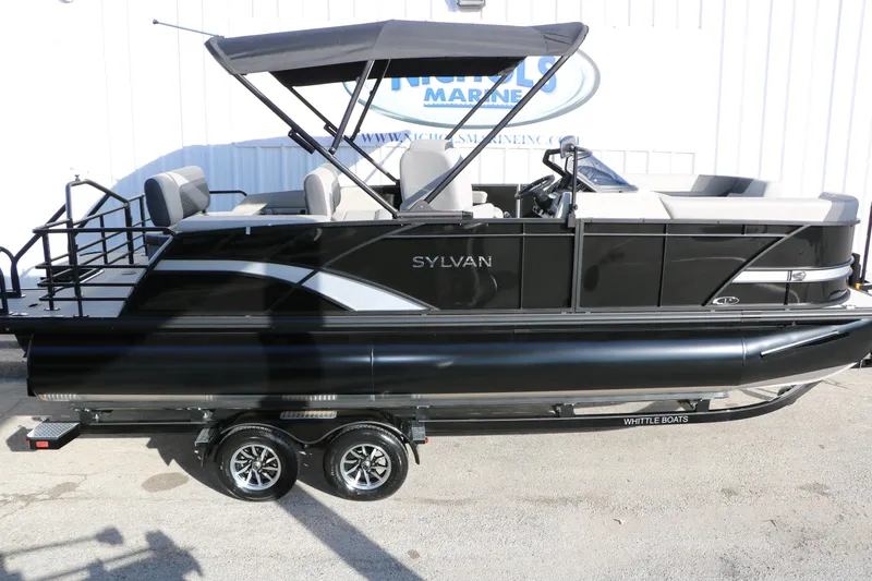 Slide: The Image of 2026 Sylvan L3 DLZ pontoon boat with sleek black design and canopy. - 35