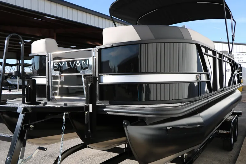 Slide: The Image of 2026 Sylvan L3 DLZ pontoon boat with sleek black design and modern features. - 7