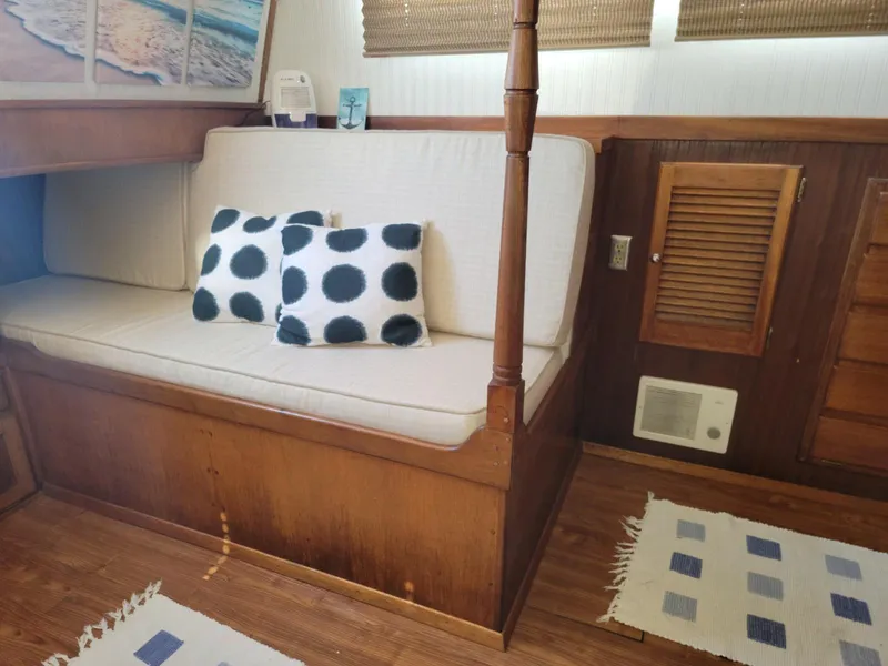 Slide: The Image of 1974 Californian 42 LRC interior with polka dot pillows and wooden accents. - 8