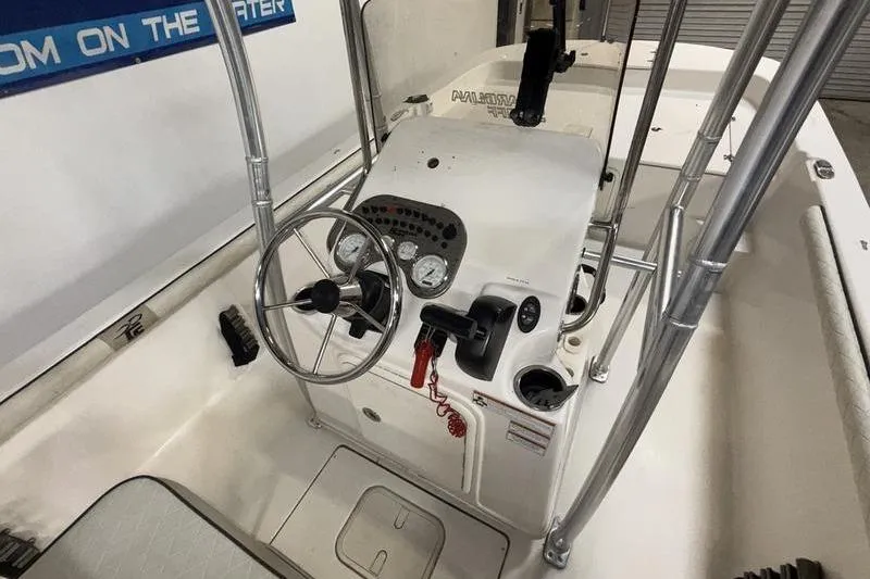 Slide: The Image of 2020 Carolina Skiff 21 LS boat console with steering wheel and gauges. - 13