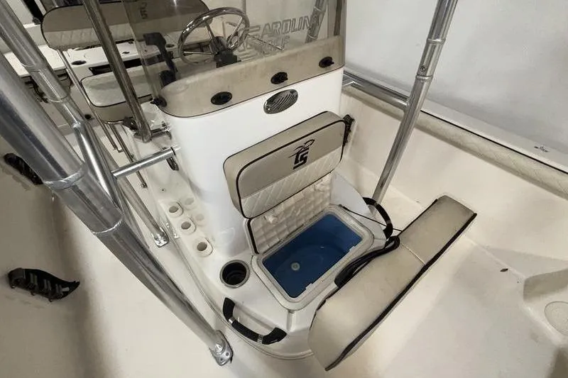 Slide: The Image of 2020 Carolina Skiff 21 LS boat interior with seating and storage compartments. - 18