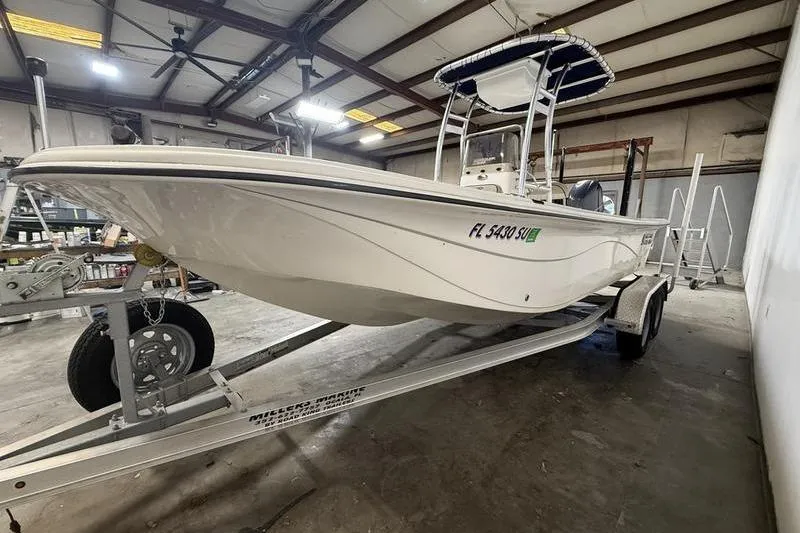 Slide: The Image of 2020 Carolina Skiff 21 LS boat on trailer in indoor storage facility. - 2