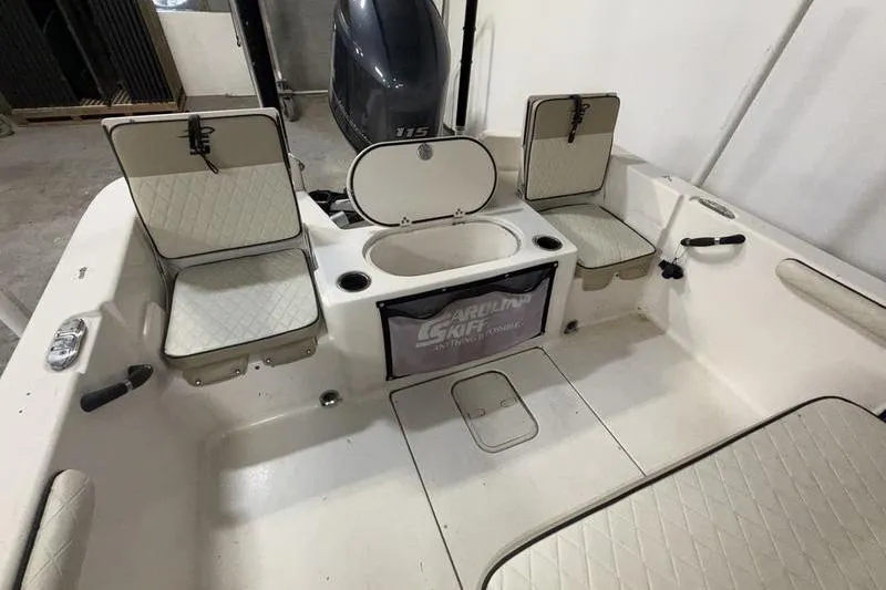 Slide: The Image of 2020 Carolina Skiff 21 LS boat interior with seating and storage compartments. - 8