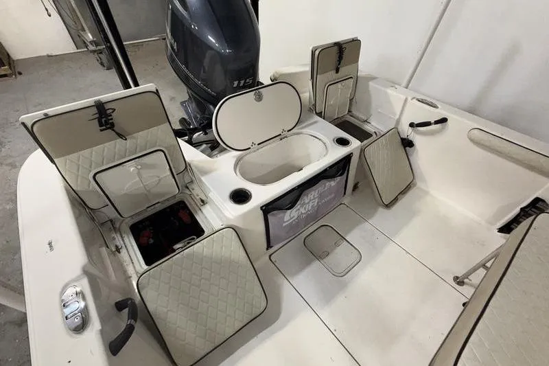 Slide: The Image of 2020 Carolina Skiff 21 LS boat interior with storage compartments and Yamaha outboard motor. - 9
