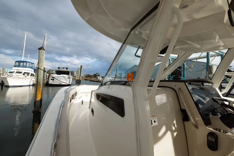 Slide: The Image of Boston Whaler 350 Realm 2023 in harbor, modern design. - 49