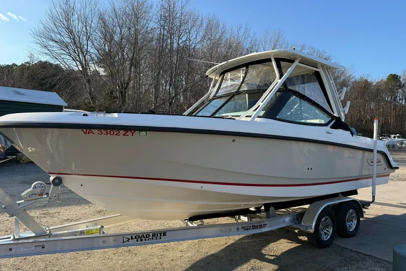 The Image of 2022 Boston Whaler 240 Vantage boat on trailer, parked outdoors. - 0