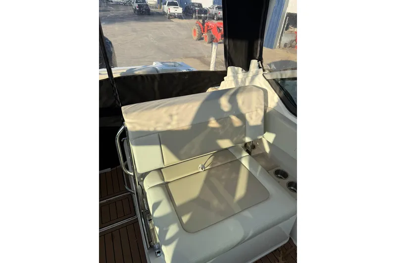 Slide: The Image of 2022 Boston Whaler 240 Vantage boat interior seating with cup holders. - 2