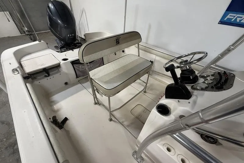 Slide: The Image of 2020 Carolina Skiff 21 LS boat interior with steering console and seating. - 10