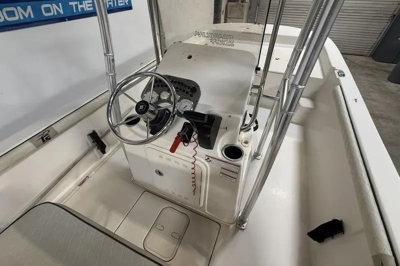Slide: The Image of 2020 Carolina Skiff 21 LS boat interior with steering console and seating. - 14