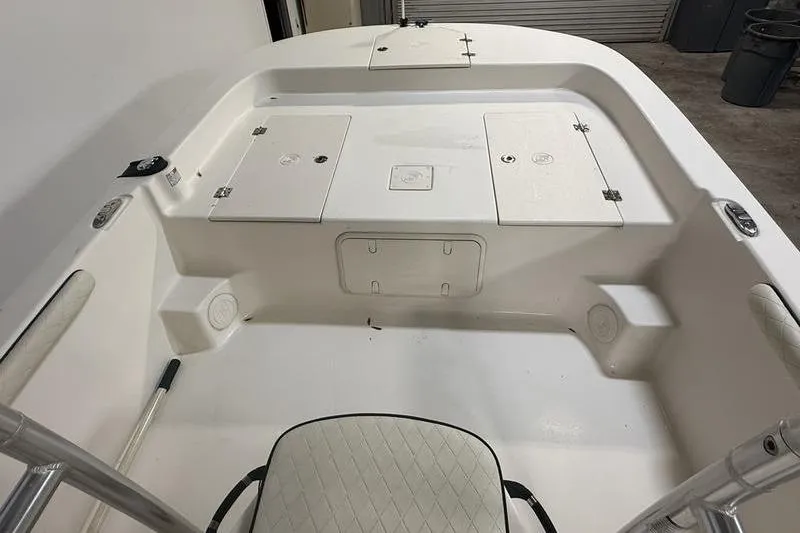 Slide: The Image of 2020 Carolina Skiff 21 LS boat interior with storage compartments and seating. - 18