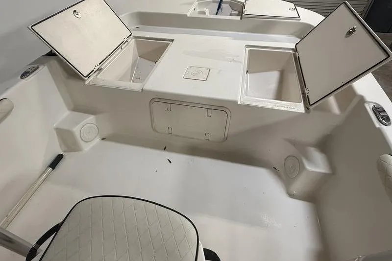 Slide: The Image of 2020 Carolina Skiff 21 LS boat interior with open storage compartments. - 19