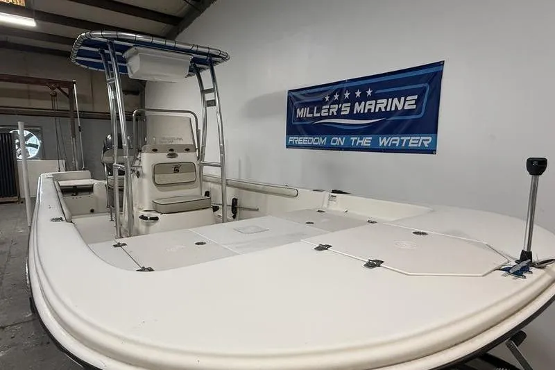 Slide: The Image of 2020 Carolina Skiff 21 LS boat displayed at Miller's Marine showroom. - 2