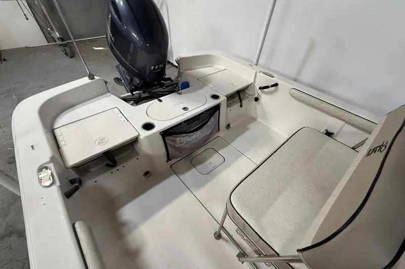 Slide: The Image of 2020 Carolina Skiff 21 LS boat interior with seating and motor. - 7