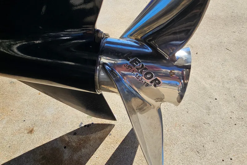 Slide: The Image of Close-up of a shiny Lexor boat propeller on a 2007 Ribcraft 6.5. - 12