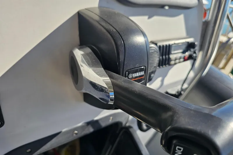 Slide: The Image of Close-up of Yamaha throttle control on 2007 Ribcraft 6.5 boat dashboard. - 15
