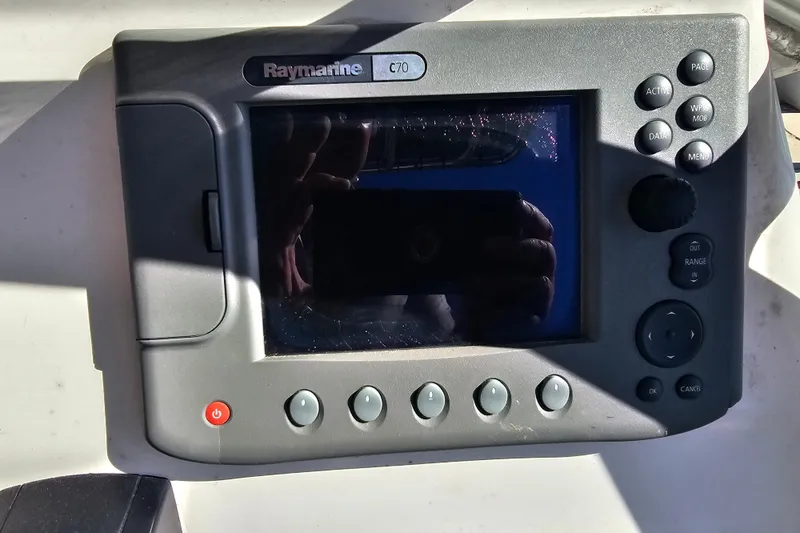 Slide: The Image of Raymarine C70 marine display on a 2007 Ribcraft 6.5 boat dashboard. - 19