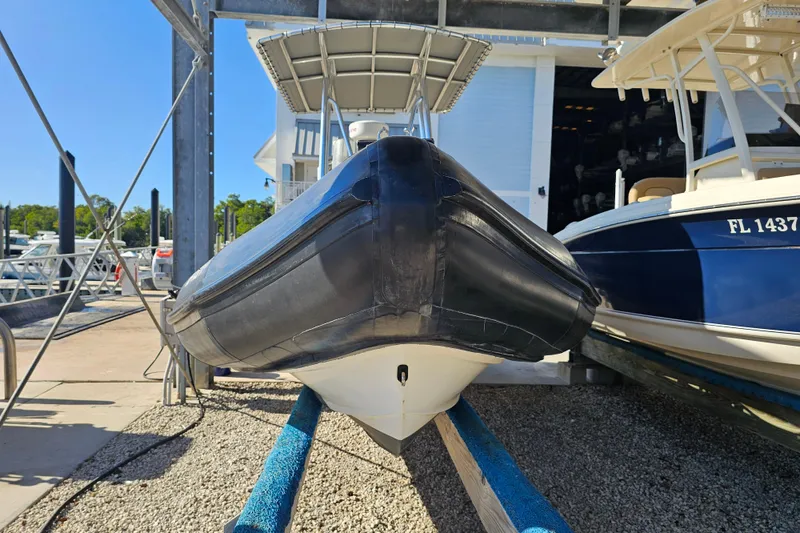 Slide: The Image of 2007 Ribcraft 6.5 boat on dry dock, front view, sunny day. - 2