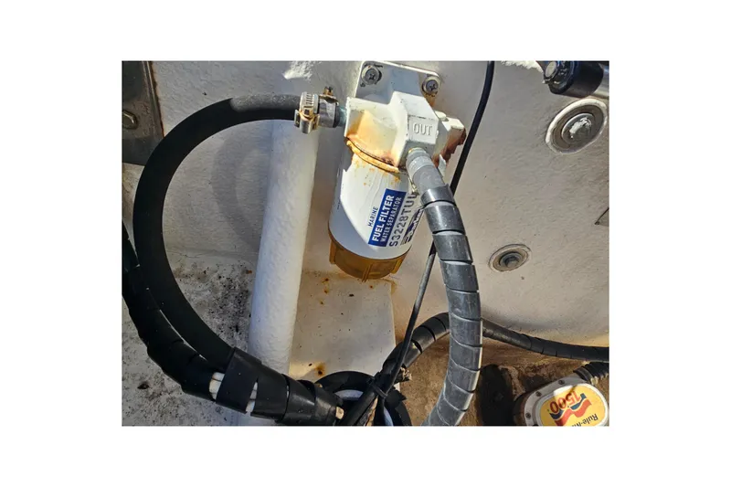 Slide: The Image of Fuel filter system on a 2007 Ribcraft 6.5 boat, featuring hoses and connectors. - 25