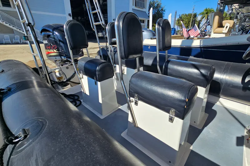 Slide: The Image of 2007 Ribcraft 6.5 boat interior with seating and Yamaha engine. - 7