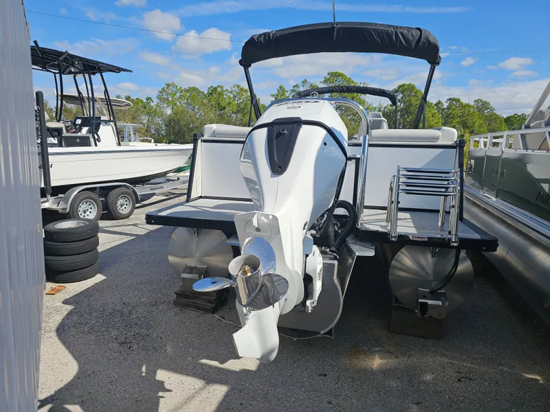 Slide: The Image of 2026 Avalon Catalina 2585 Quad Lounger Pontoon with outboard motor. - 2