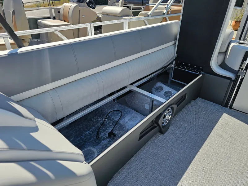 Slide: The Image of Interior of Avalon Catalina 2585 Quad Lounger 2026 with seating and storage. - 24