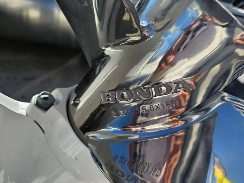 Slide: The Image of Close-up of a Honda propeller on an Avalon pontoon. - 5