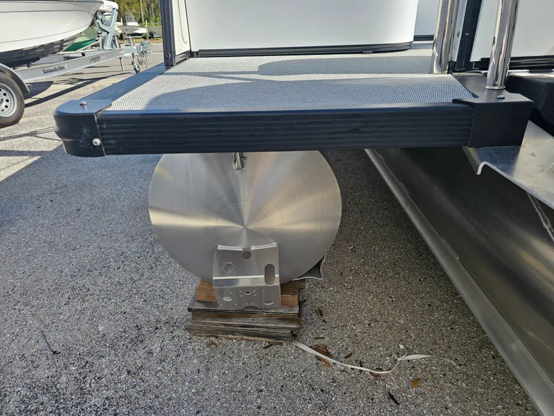 Slide: The Image of Avalon Luxury Pontoons CATALINA 2585, close-up of pontoon on trailer. - 7