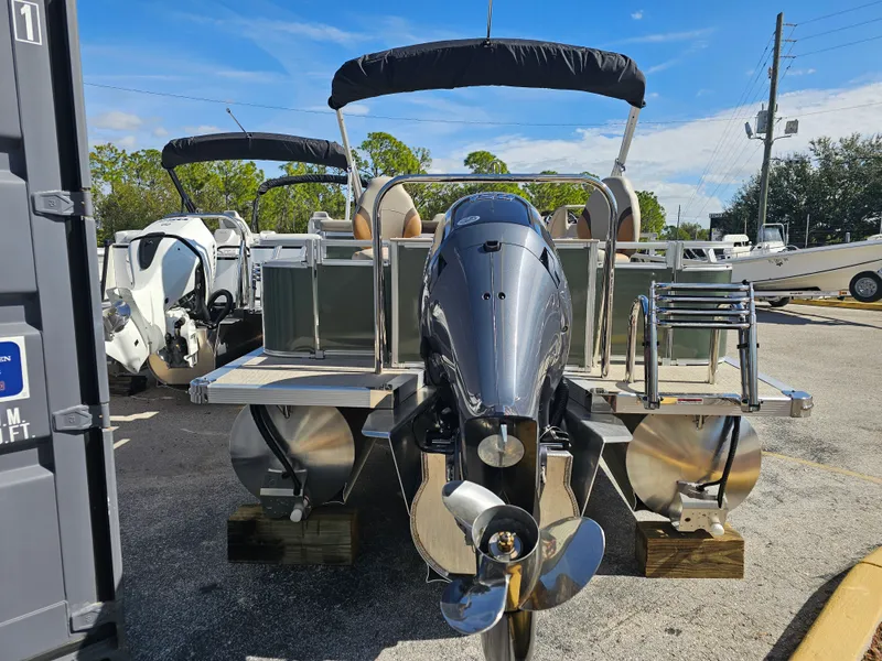 Slide: The Image of 2026 Avalon Venture 85 Rear Fish Tritoon on parking lot. - 1