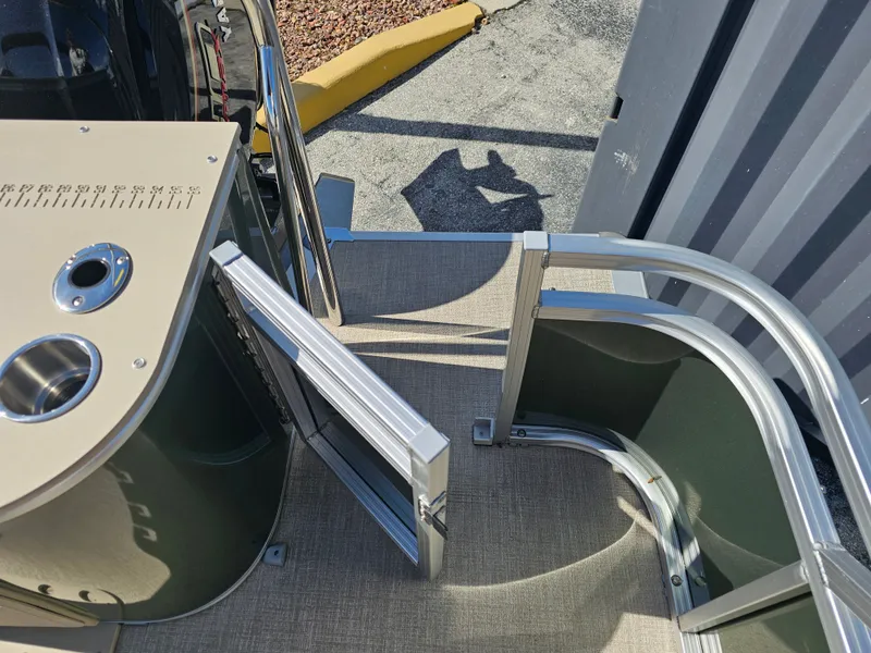 Slide: The Image of Avalon Venture 85 Tritoon with open door and stainless steel railing. - 20