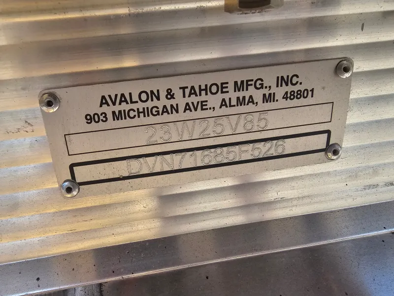 Slide: The Image of Metal plate from Avalon & Tahoe Mfg., Inc. on a pontoon boat. - 24