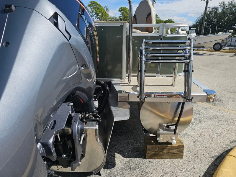 Slide: The Image of 2026 Avalon Venture 85 Tritoon with motor and ladder. - 3