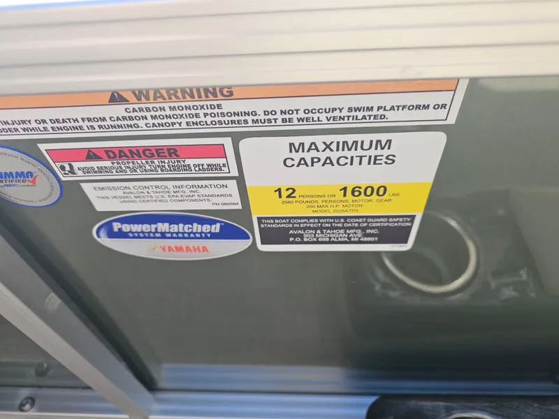 Slide: The Image of Warning labels and capacity details on Avalon pontoon boat. - 9