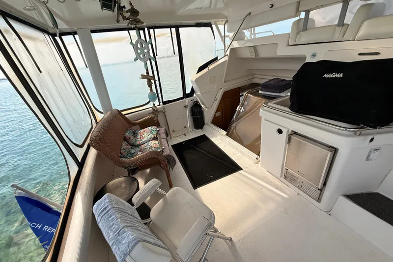 Slide: The Image of 1998 Silverton 40 Convertible yacht interior with seating and ocean view. - 18