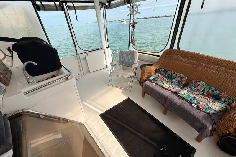 Slide: The Image of Interior of 1998 Silverton 40 Convertible boat with seating and ocean view. - 19