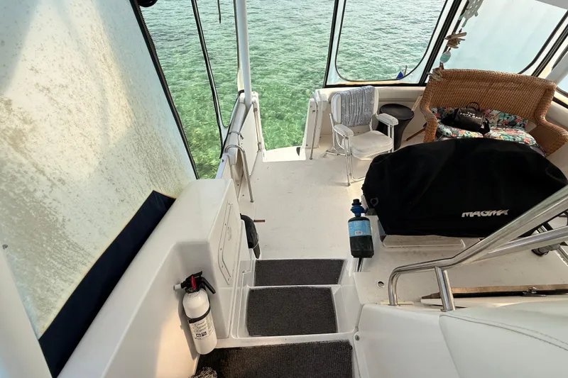 Slide: The Image of 1998 Silverton 40 Convertible boat interior with seating and ocean view. - 37