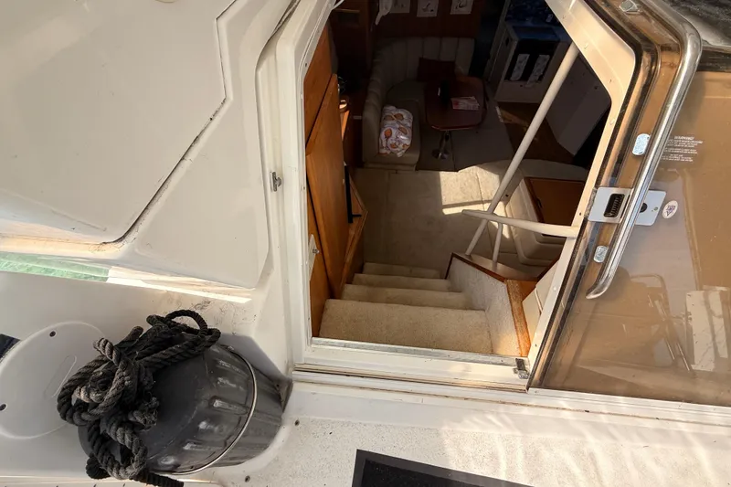 Slide: The Image of Interior view of 1998 Silverton 40 Convertible yacht, showing stairs and cabin area. - 40