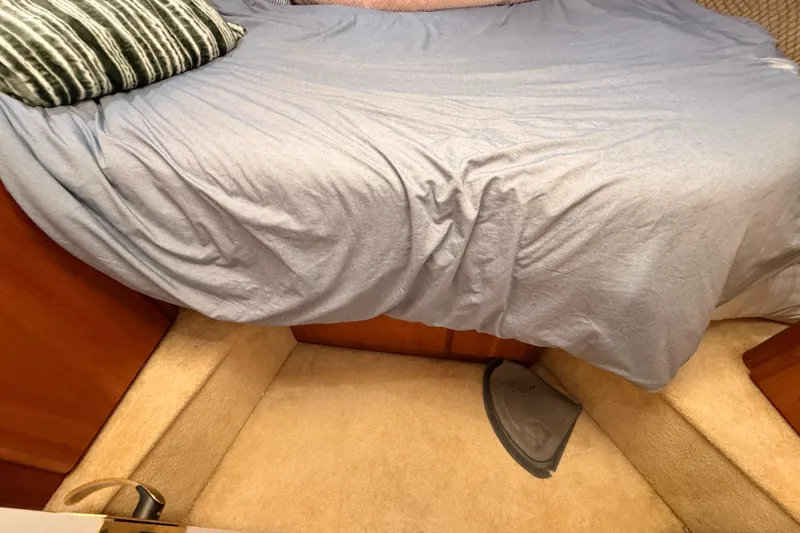 Slide: The Image of Interior cabin of 1998 Silverton 40 Convertible with bed and carpeted floor. - 62