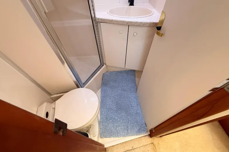 Slide: The Image of Bathroom interior of 1998 Silverton 40 Convertible yacht with shower and sink. - 64