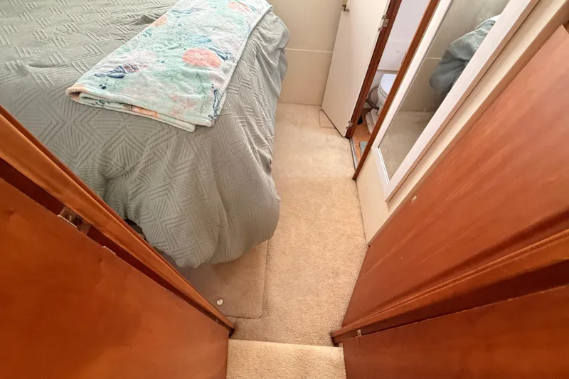 Slide: The Image of Interior of 1998 Silverton 40 Convertible yacht with cozy bedroom and bathroom. - 74