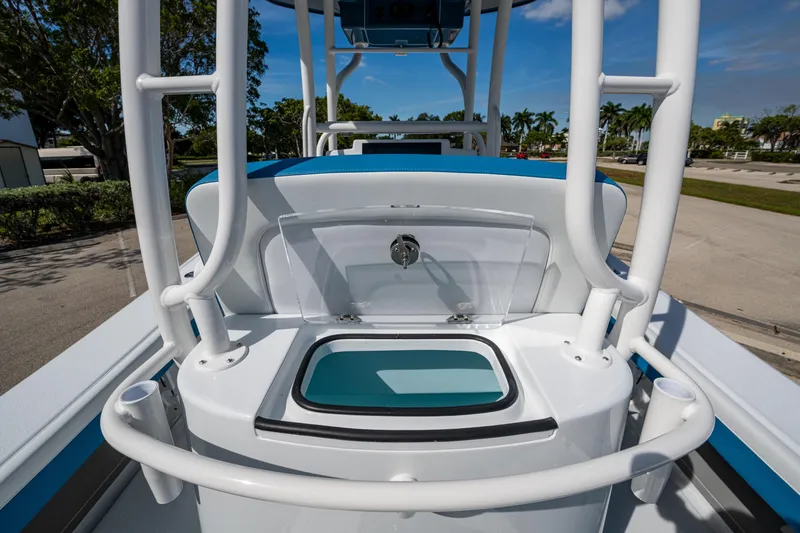 Slide: The Image of 2026 Yellowfin 26 Hybrid boat with open storage compartment, surrounded by white railings. - 31