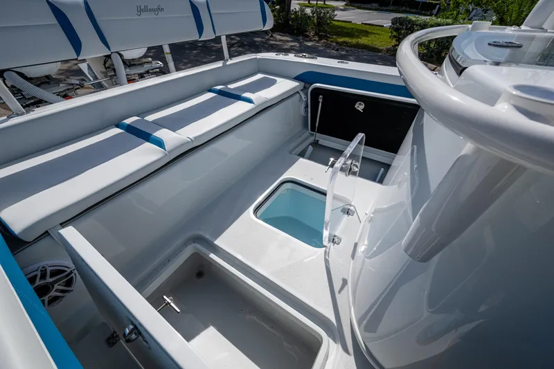 Slide: The Image of 2026 Yellowfin 26 Hybrid boat interior with seating and storage compartments. - 36