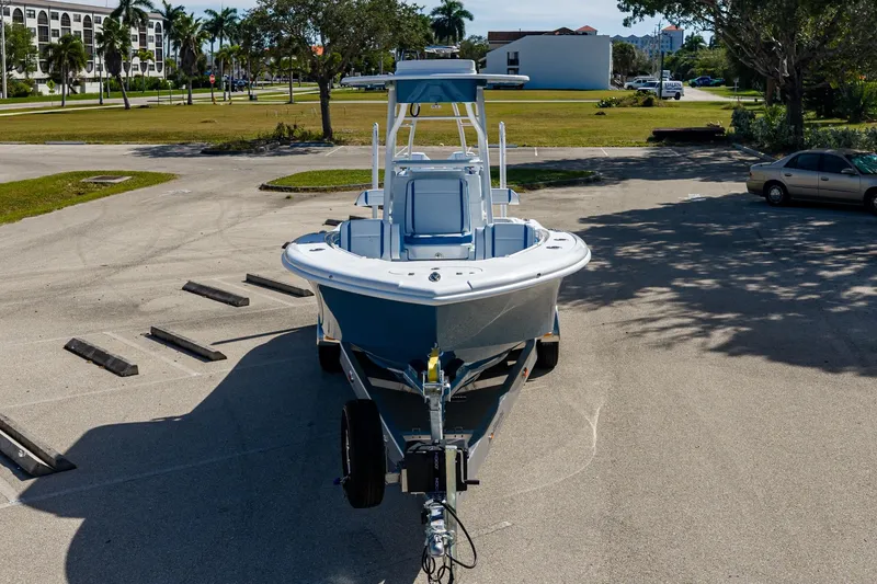 Slide: The Image of 2026 Yellowfin 26 Hybrid boat on trailer in sunny parking lot. - 5