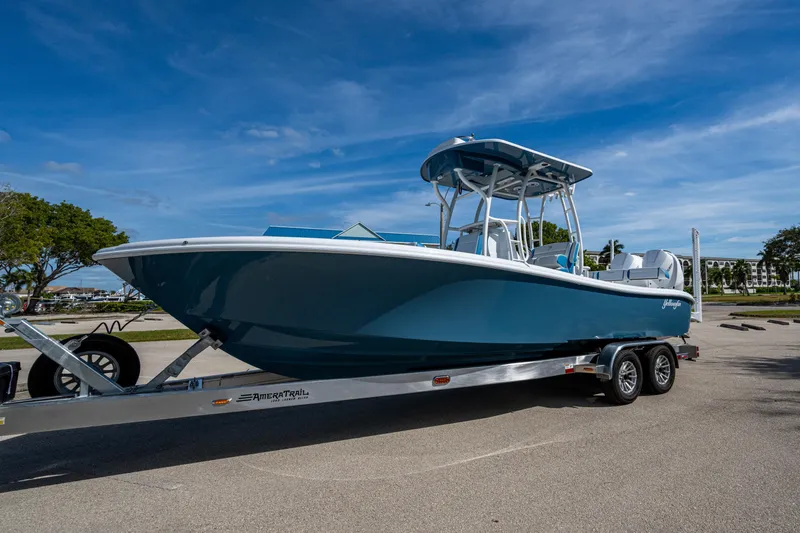 Slide: The Image of 2026 Yellowfin 26 Hybrid boat on trailer under clear blue sky. - 54