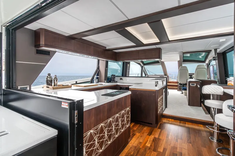 Slide: The Image of Luxurious interior of 2023 Galeon 640 Fly yacht with modern kitchen and ocean view. - 16