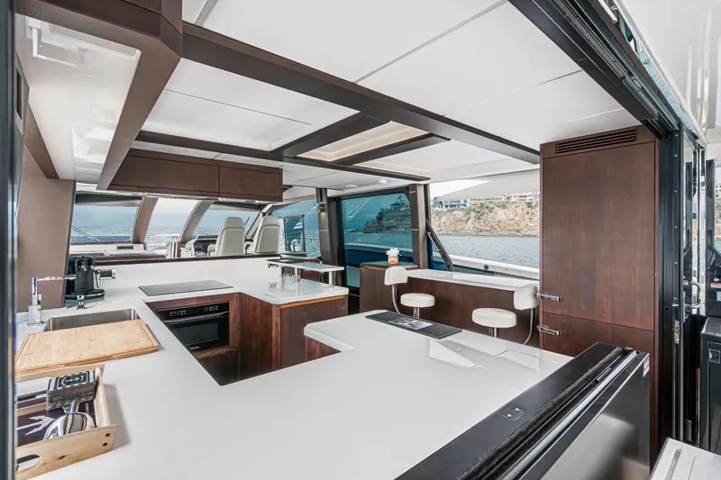 Slide: The Image of Luxurious interior of 2023 Galeon 640 Fly yacht with modern kitchen and ocean view. - 20