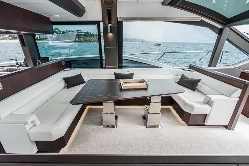 Slide: The Image of Luxurious interior of 2023 Galeon 640 Fly yacht with elegant seating and sea view. - 24