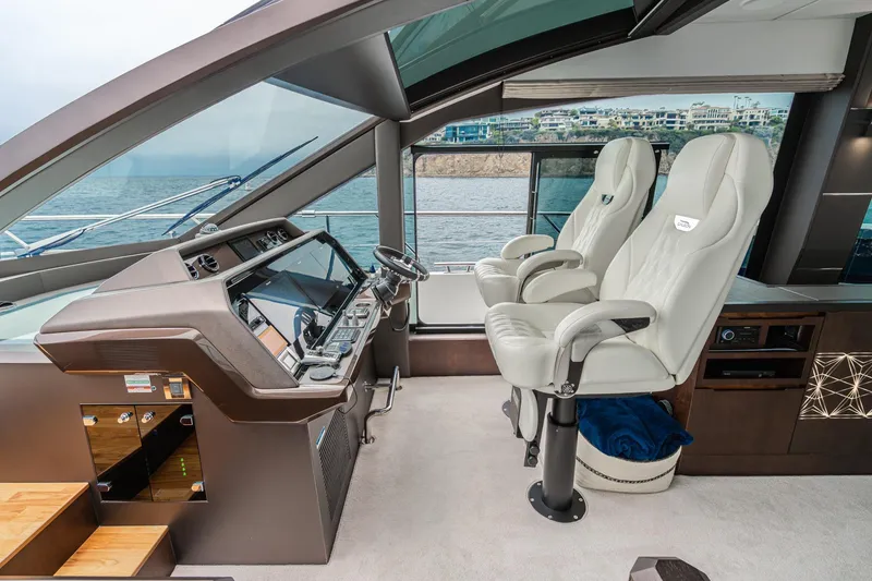 Slide: The Image of Luxurious 2023 Galeon 640 Fly yacht cockpit with modern controls and plush seating. - 27